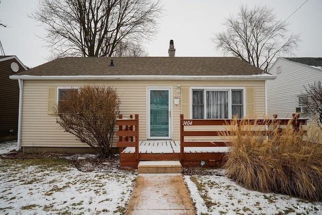 bungalow-style house with a deck