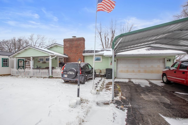 exterior space featuring a porch and a garage