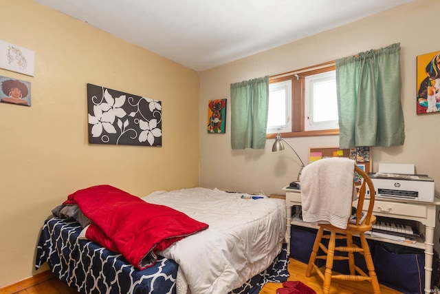 bedroom with wood-type flooring