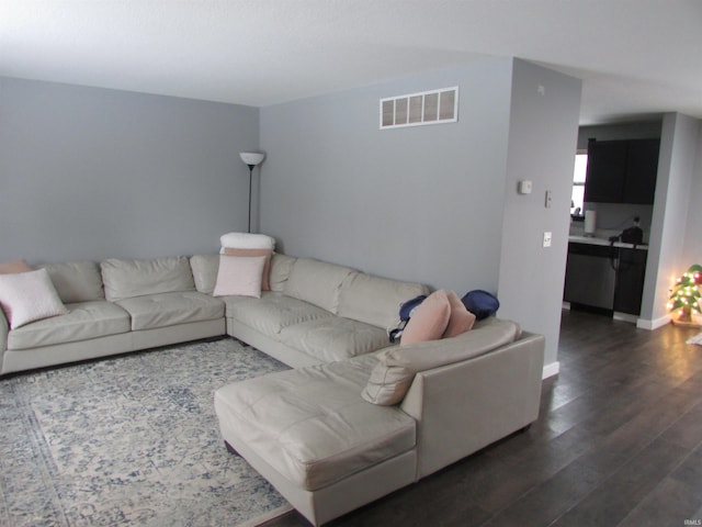 living room with dark hardwood / wood-style flooring