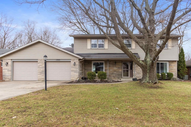 view of front of home with a garage and a front lawn