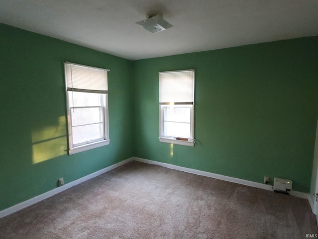 empty room featuring carpet flooring