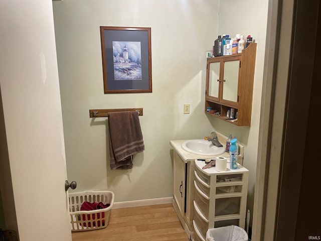 bathroom featuring vanity and hardwood / wood-style flooring