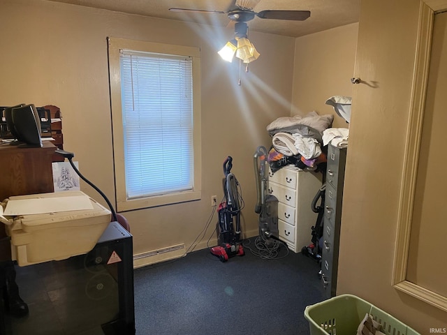 bedroom with baseboard heating and ceiling fan