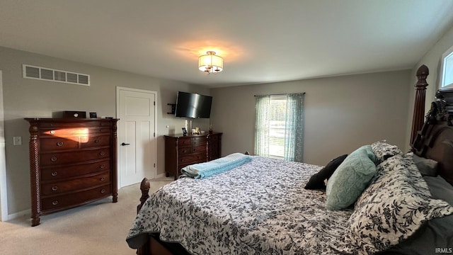 bedroom featuring light colored carpet