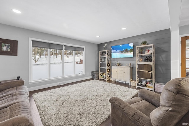 living room with dark hardwood / wood-style flooring