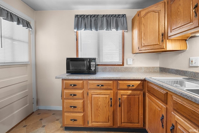 kitchen with light tile patterned floors