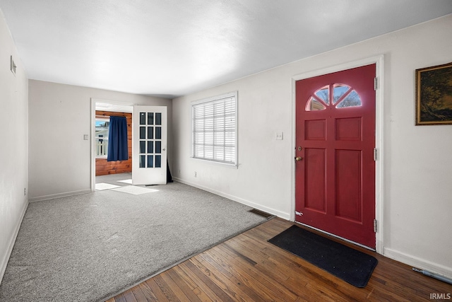 entrance foyer with hardwood / wood-style flooring and french doors