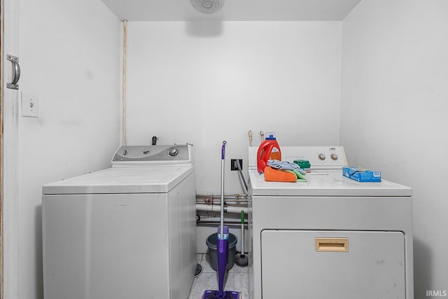 laundry area featuring separate washer and dryer and tile patterned floors