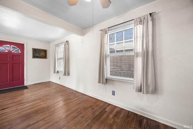 foyer entrance featuring beamed ceiling, hardwood / wood-style flooring, and ceiling fan