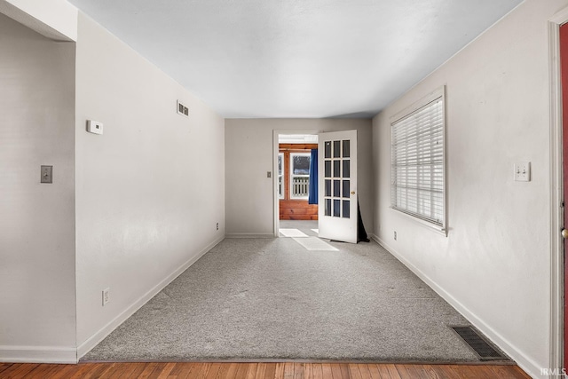 spare room featuring french doors