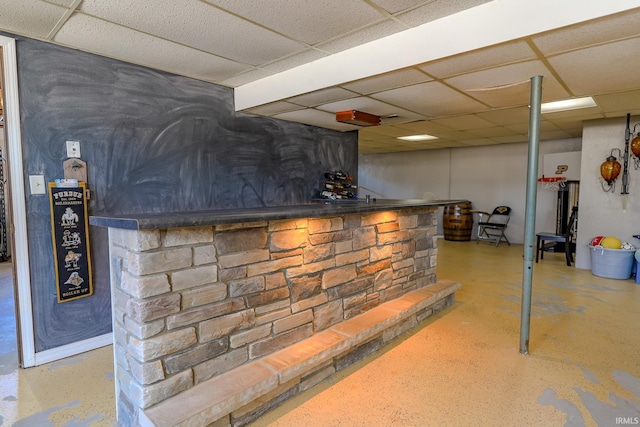 bar featuring a paneled ceiling