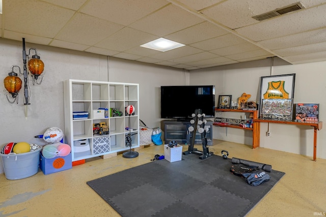 exercise room featuring a drop ceiling