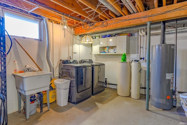 basement with washer and dryer and water heater