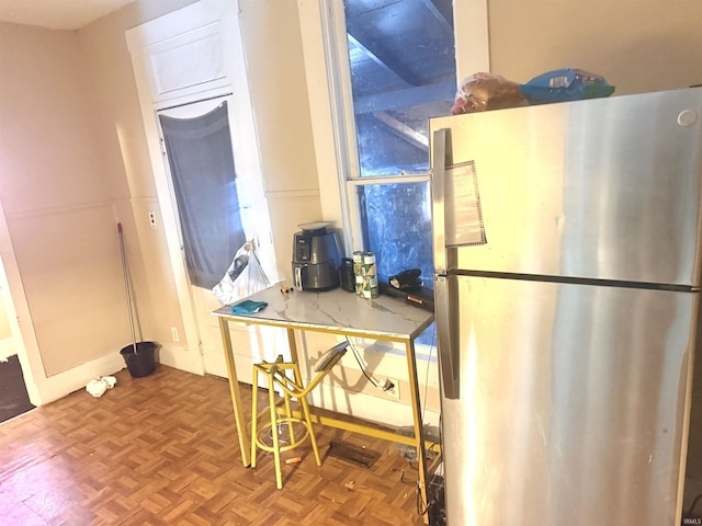 kitchen featuring stainless steel fridge and parquet floors