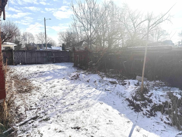 view of yard layered in snow