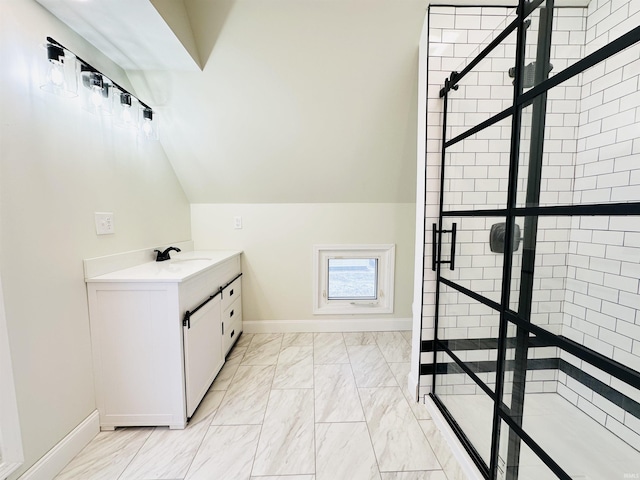 bathroom with vanity and lofted ceiling