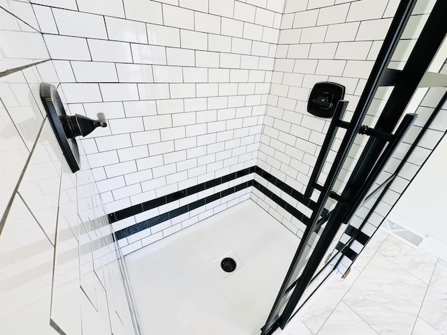 bathroom with tiled shower