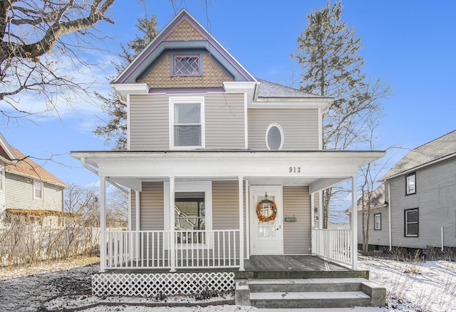 victorian house featuring a porch