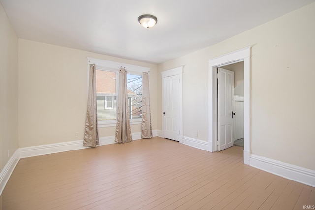 spare room featuring light wood-type flooring