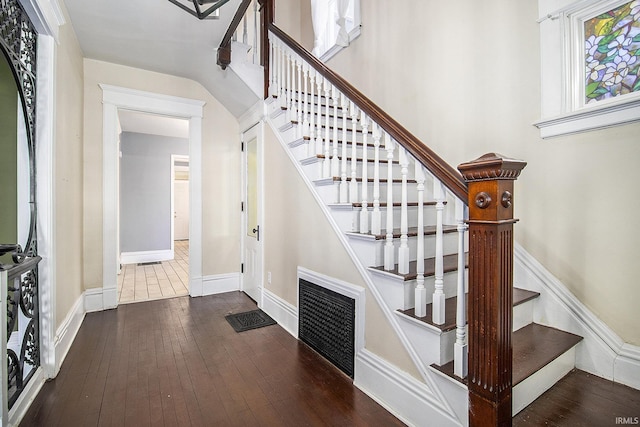 stairs with hardwood / wood-style flooring