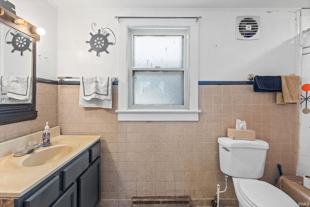 bathroom featuring vanity, crown molding, toilet, tile walls, and curtained shower