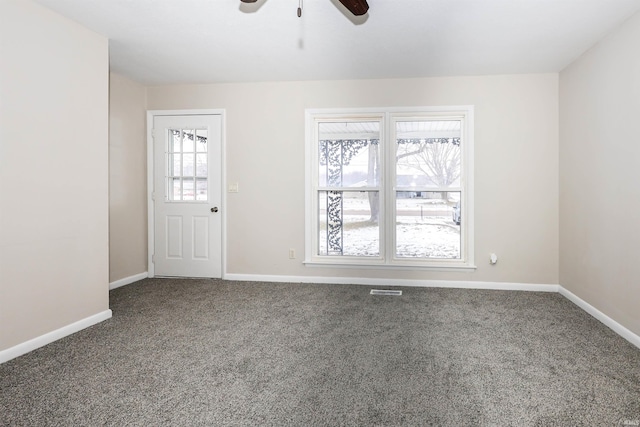 interior space with ceiling fan