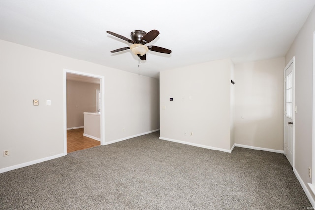 unfurnished room with carpet flooring and ceiling fan