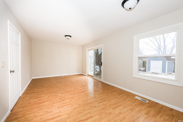 unfurnished room with light hardwood / wood-style flooring