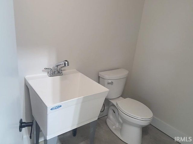 bathroom with toilet and sink