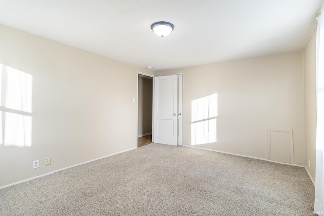 spare room with light carpet