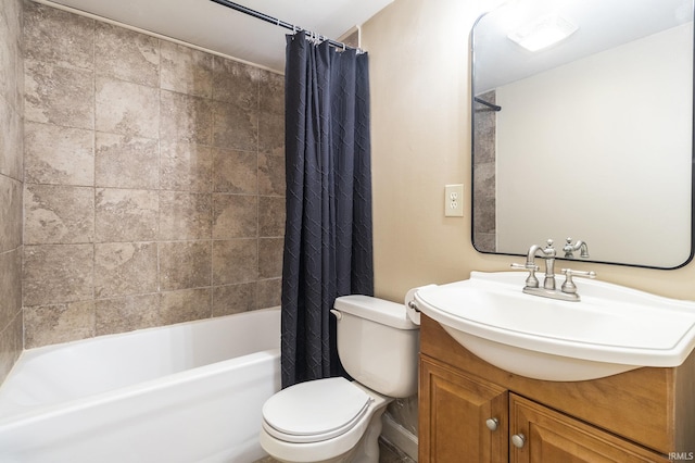 full bathroom featuring shower / tub combo with curtain, vanity, and toilet