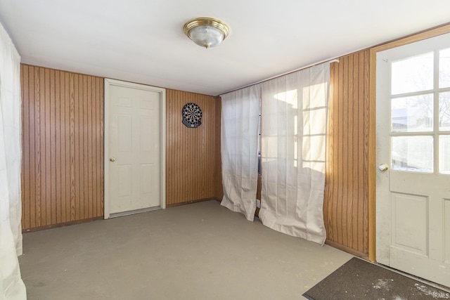 interior space featuring wooden walls