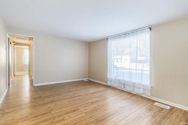 unfurnished room with light hardwood / wood-style flooring