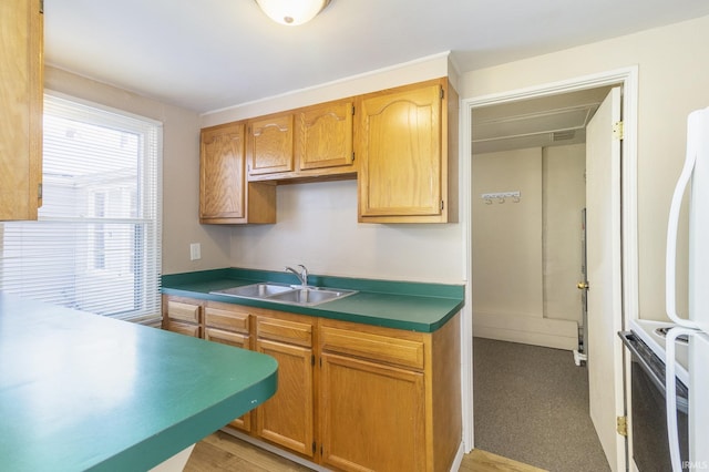 kitchen featuring sink and white appliances