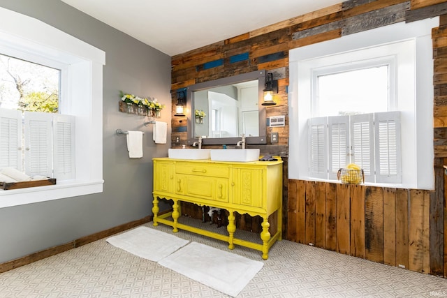 bathroom with wooden walls and vanity