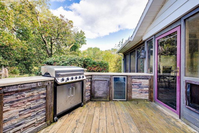 wooden deck featuring an outdoor kitchen