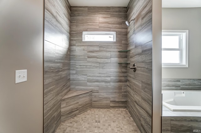 bathroom with separate shower and tub