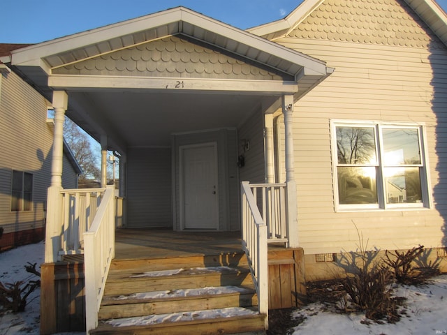 entrance to property featuring a porch