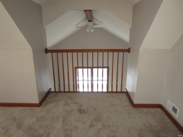 bonus room with light colored carpet and ceiling fan