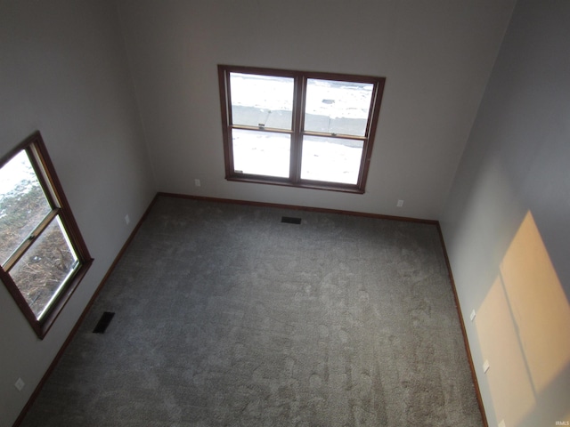 empty room with dark carpet