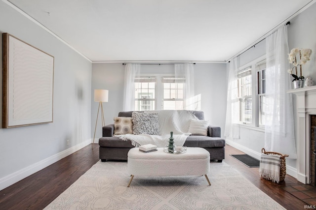 living room featuring wood-type flooring and ornamental molding