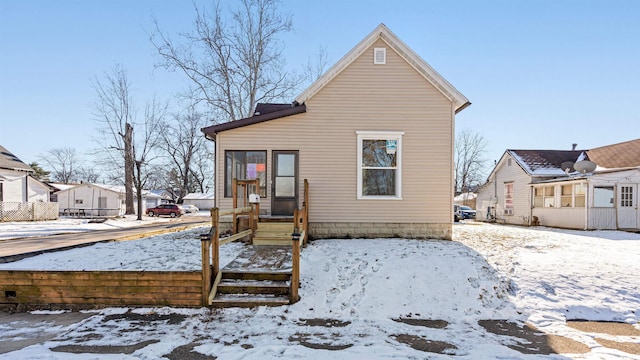 view of snow covered house