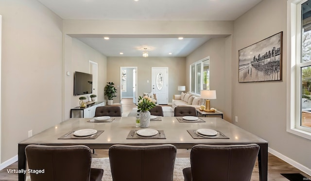 dining area with hardwood / wood-style flooring