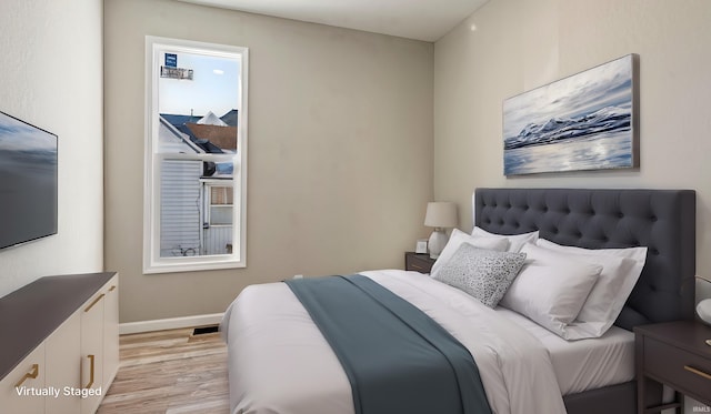 bedroom featuring light hardwood / wood-style floors