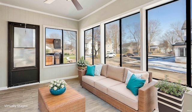 sunroom / solarium with ceiling fan