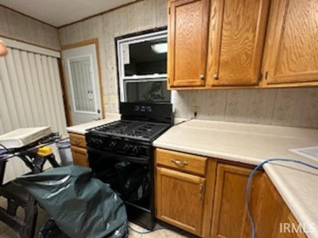 kitchen with black gas range oven