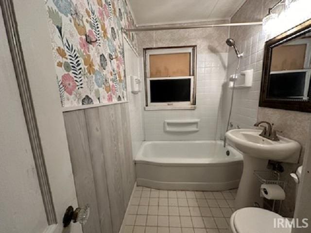 bathroom featuring toilet, bathtub / shower combination, and tile patterned floors