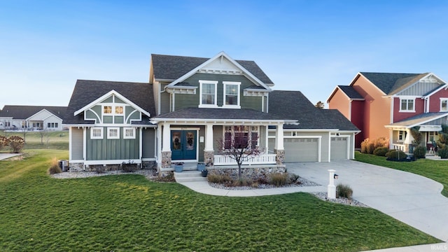 view of front facade featuring french doors, a porch, a front lawn, and a garage