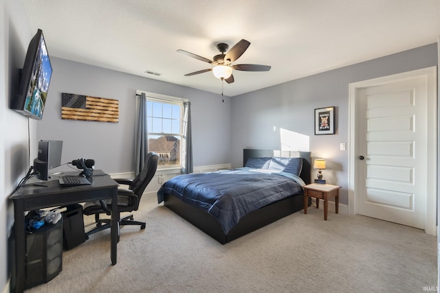 carpeted bedroom featuring ceiling fan